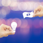 Business concept Hand hold white paper idea and money bokeh background.