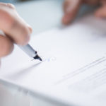 Businessman is signing a contract, business contract details