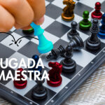 Business strategy concept on wooden background hand moving chess figure in competition.