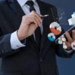 Businessman analytics 3d information financial on smartphone